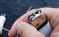 burn end of elastic thread