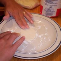 use cookie cutter or hands to model clay