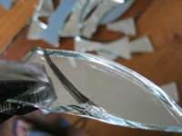 break mosaic mirror using plumbers pliers