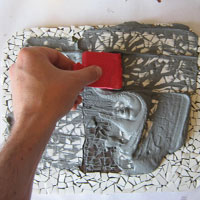 spread mosaic grout