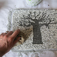 wipe excess grout using damp cloth
