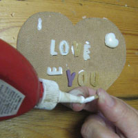 glue resin letters onto heart