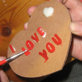 resin letters painted on heart board