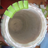 glue tiles to the top of mosaic pot