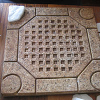 stick stones onto mosaic stepping stone