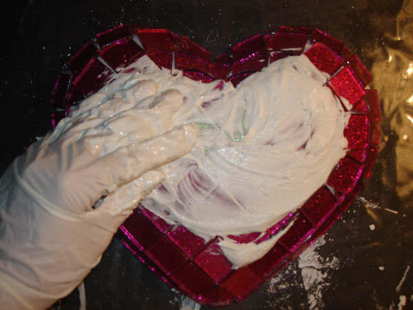 apply grout to mosaic heart