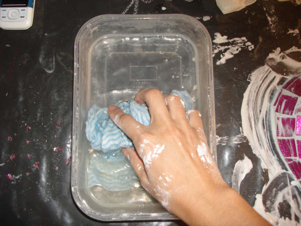 clean mosaic grout with bowl and water