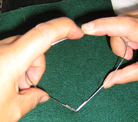 bend the wire into a heart shape