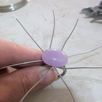 cabochon gem stone in centre of wire spiral wrap ring