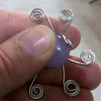 press cabochon gemstone onto the wire ring