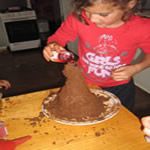 Pour the vinager and food colouring in to the volcano