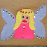glue sequin decorations onto fairy