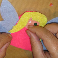 glue the sequin eyes into place