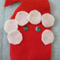 glue felt dots onto father christmas to create a beard