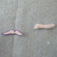 cut out moustache from white felt using the paper template