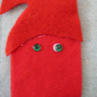 glue the sequin eyes for father christmas into place