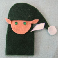 cut out elf ears from peach felt