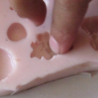 filling silicon mould with crazy clay