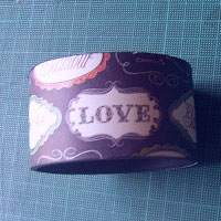 cut paper and cover the recycled cardboard using double-sided tape