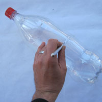 make a slit on recycled plastic coke bottle