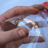 cut slits in plastic coke bottle
