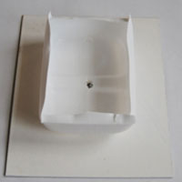 glue milk bottle base onto hardboard