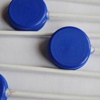 glue bottle caps and skewers together