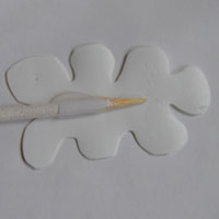 glue plastic shape onto skewer