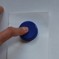 trace plastic bottle cap onto milk bottle
