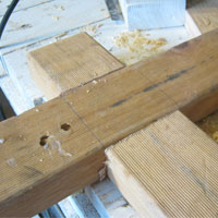 wooden beams fit to form a wooden cross